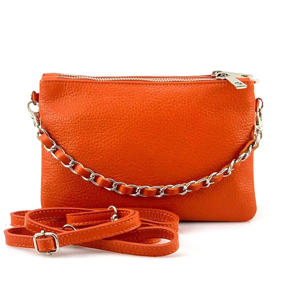 Fernanda leather clutch in orange with metal chain