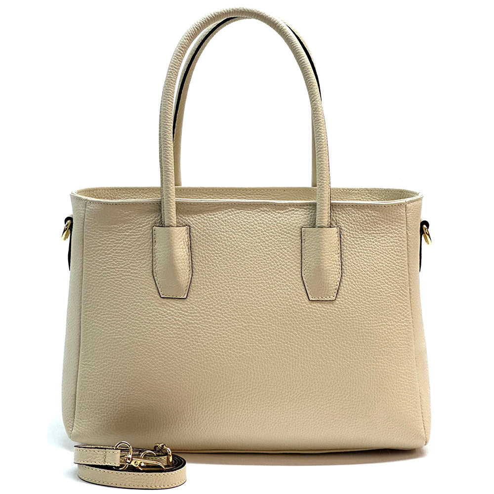 Beige handbag with a strap on a white background