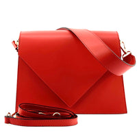 Red leather handbag with a strap on a white background