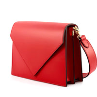 Red handbag with a gold zipper on a white background