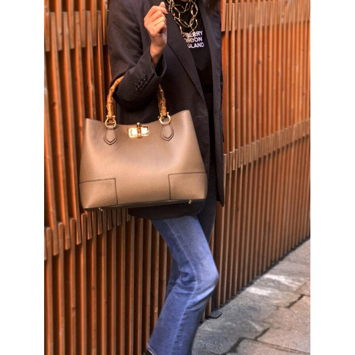 Woman holding a stylish Italian Leather Tote Bag