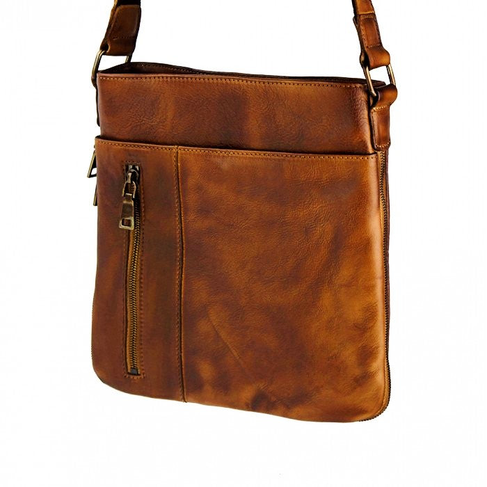 angled view of monza small brown leather messenger bag