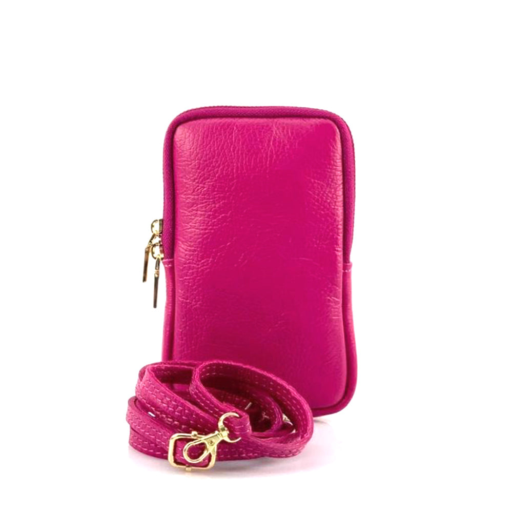 Alexis Leather phone holder in fuchsia - front view with strap and gold closure