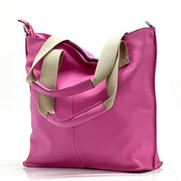 The tote bag closed, highlighting its classic design and available colors.