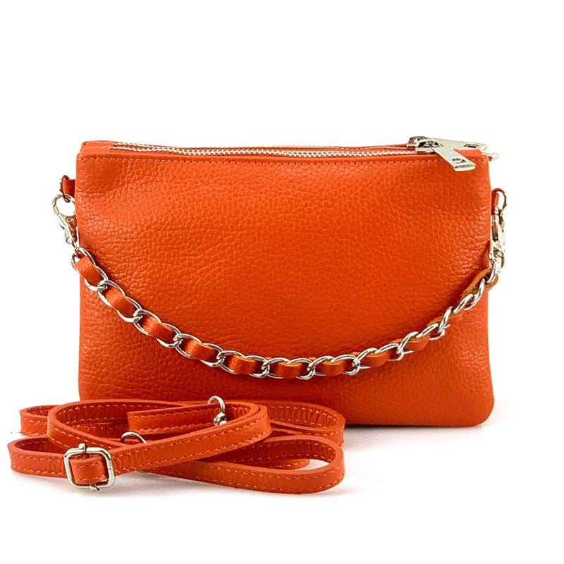 Fernanda leather clutch in orange with metal chain