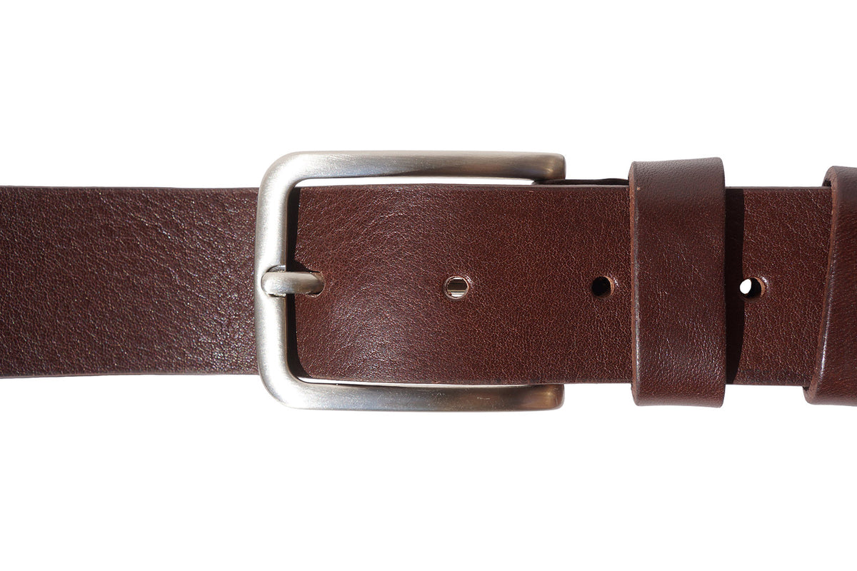A close-up view of the leather belt's buckle, highlighting its intricate design and polished finish.