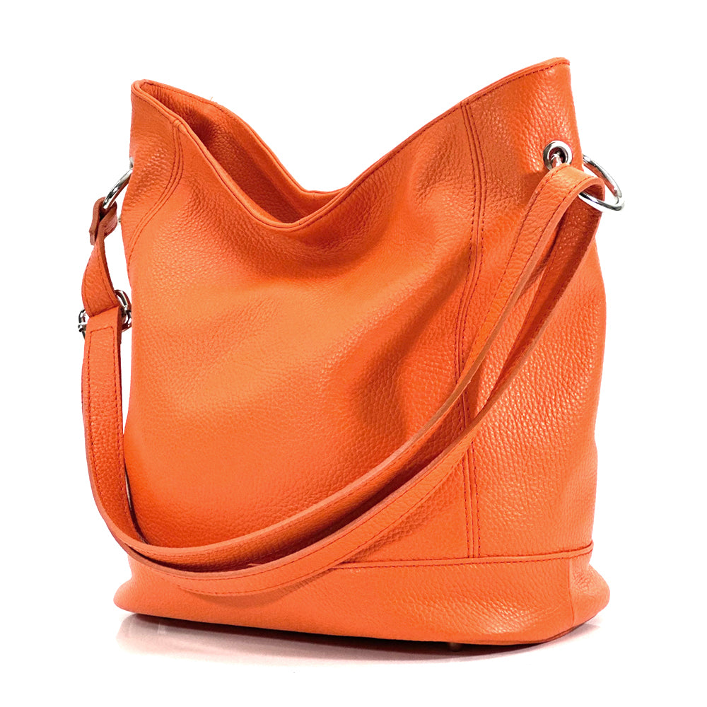 Leather City Bag in orange showing shoulder strap