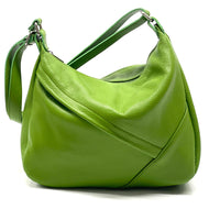 Pretty green leather shoulder bag with adjustable strap.