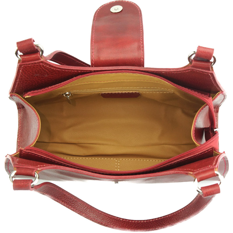 The Floriana handbag open, displaying the interior compartments and closure.