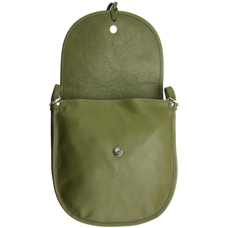 Interior view of the Elisa cross-body bag in green showing button closure